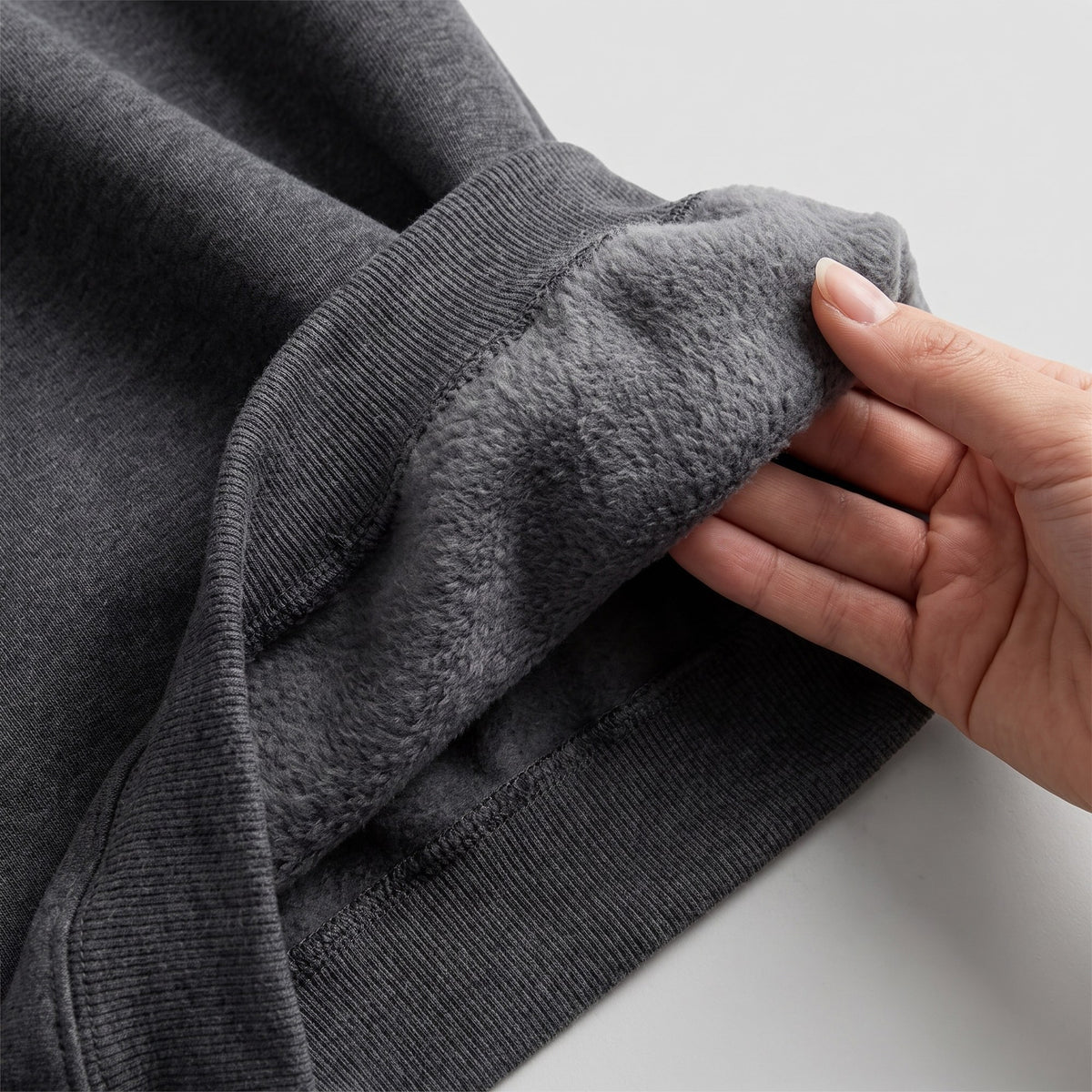 Close-up of the blanket-soft brushed fleece lining inside the Junemae hoodie dress